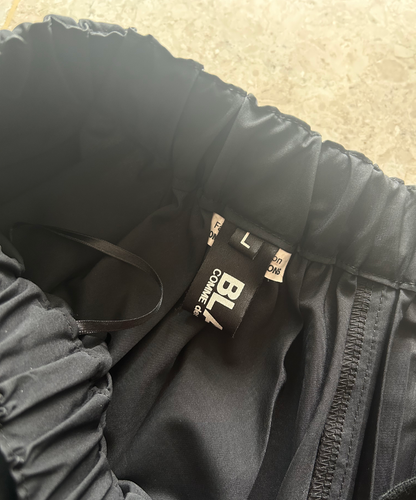 Black Comme des Garcons SS22 2-way asymmetrical pleated skirt